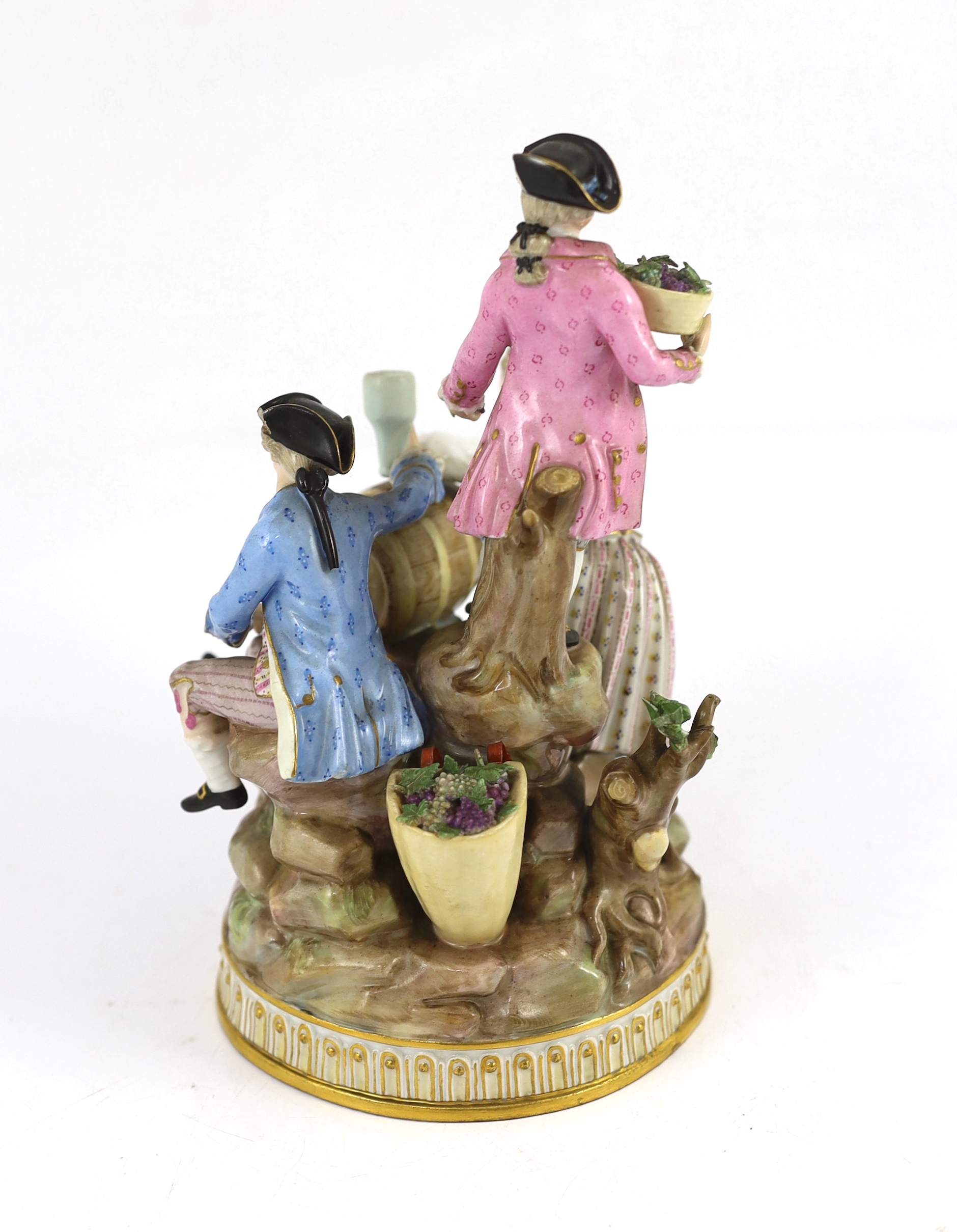 A Meissen group of grape pickers with barrels of wine, 19th century, chips to hats